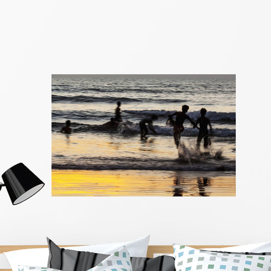 India, Karnataka, Blurry Figures In Crashing Waves At Gokarna Beach Wall Mural
