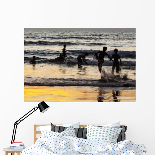 India, Karnataka, Blurry Figures In Crashing Waves At Gokarna Beach Wall Mural