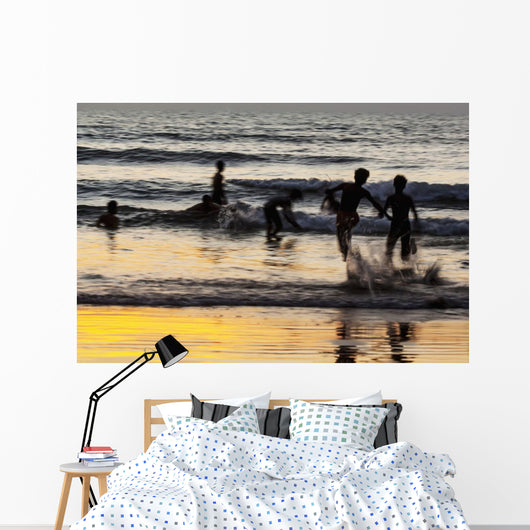 India, Karnataka, Blurry Figures In Crashing Waves At Gokarna Beach Wall Mural