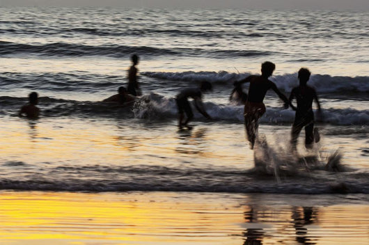 India, Karnataka, Blurry Figures In Crashing Waves At Gokarna Beach Wall Mural