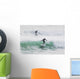 Surfers riding waves Wall Mural