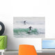 Surfers riding waves Wall Mural