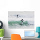 Surfers riding waves Wall Mural