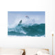 Surfer diving into water off his surfboard Wall Mural