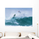 Surfer diving into water off his surfboard Wall Mural