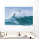 Surfer diving into water off his surfboard Wall Mural
