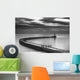 A curving pier with a lighthouse Wall Mural