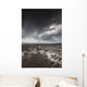 Rippled sand under a dark cloud Wall Mural