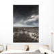 Rippled sand under a dark cloud Wall Mural