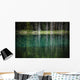 Trees reflected in the blue-green water of a small spring fed pond Wall Mural