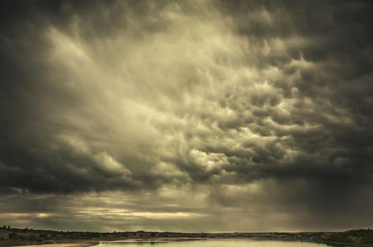 Mammatus storm clouds above a lake Wall Mural