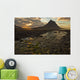 The mountain Kirkjufell rises above the ocean as the sun sets Wall Mural