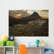 The mountain Kirkjufell rises above the ocean as the sun sets Wall Mural
