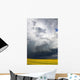 Storm clouds gather over a sunlit canola field in southern Alberta Wall Mural