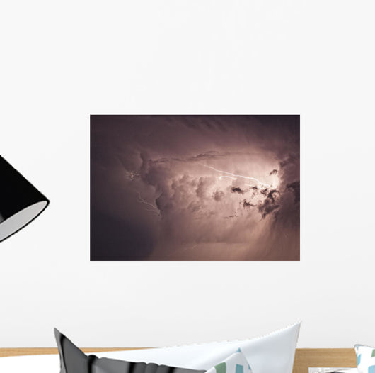 Lightning arcs between clouds during a storm Wall Mural