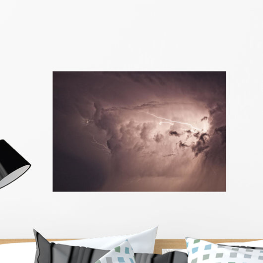 Lightning arcs between clouds during a storm Wall Mural