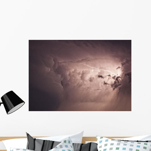 Lightning arcs between clouds during a storm Wall Mural