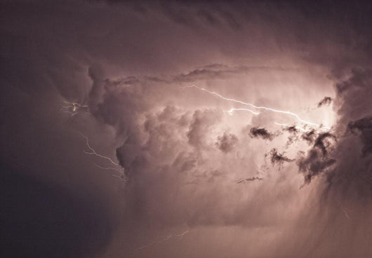 Lightning arcs between clouds during a storm Wall Mural