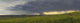Rain from a thunderstorm falls over Grasslands National Park Wall Mural