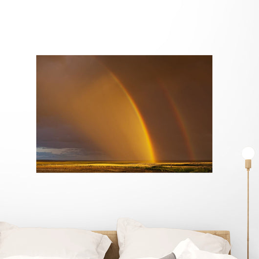 Double rainbow over a prairie field after a storm Wall Mural