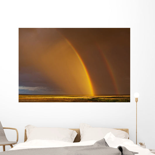 Double rainbow over a prairie field after a storm Wall Mural