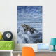 The tide coming in and flowing around a sunken piece of driftwood Wall Mural