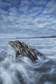 The tide coming in and flowing around a sunken piece of driftwood Wall Mural