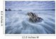 The tide coming in and flowing around a sunken piece of driftwood Wall Mural