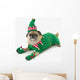 A pug in a christmas elf costume;St albert, alberta, canada Wall Mural