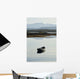 A rowboat sits Wall Mural
