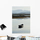 A rowboat sits Wall Mural
