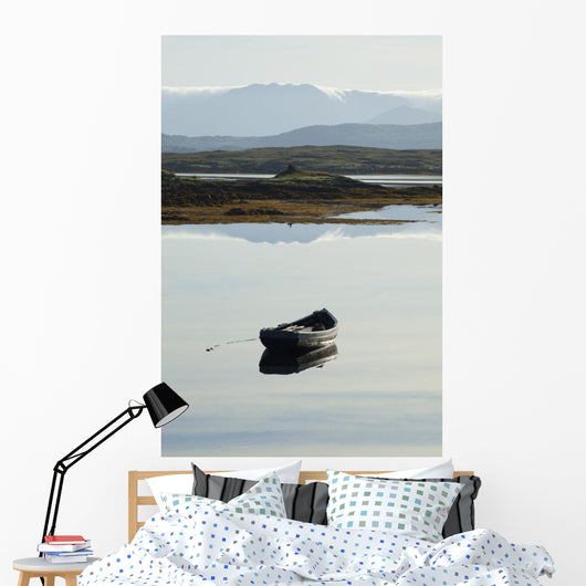 A rowboat sits Wall Mural