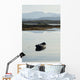 A rowboat sits Wall Mural