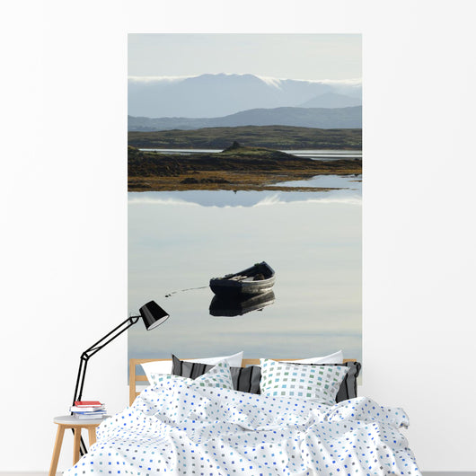 A rowboat sits Wall Mural