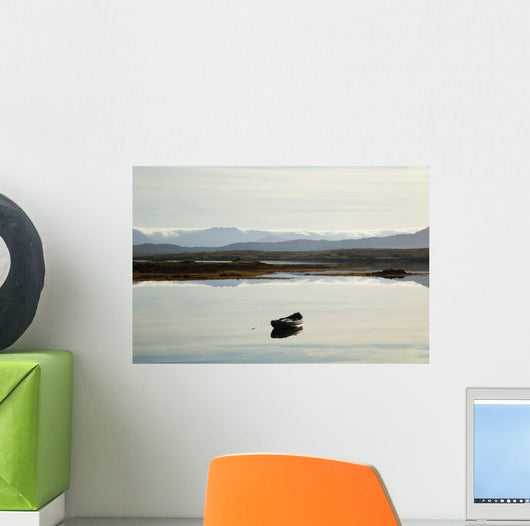 A rowboat sits Wall Mural