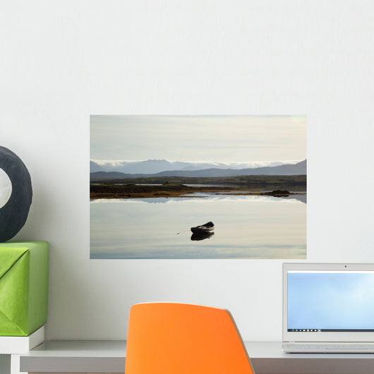 A rowboat sits Wall Mural