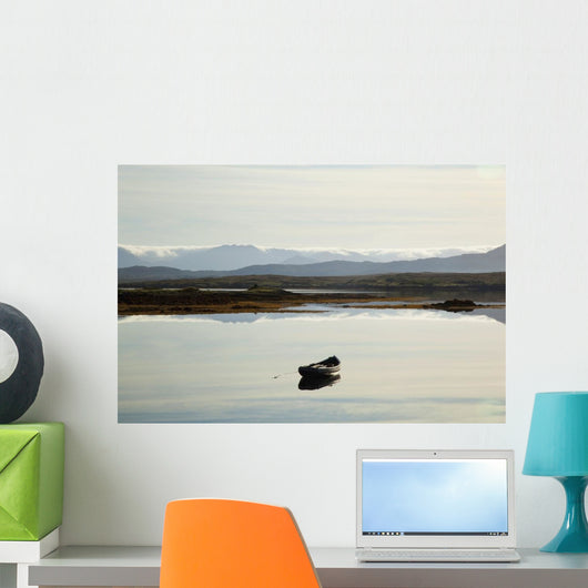 A rowboat sits Wall Mural