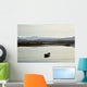 A rowboat sits Wall Mural