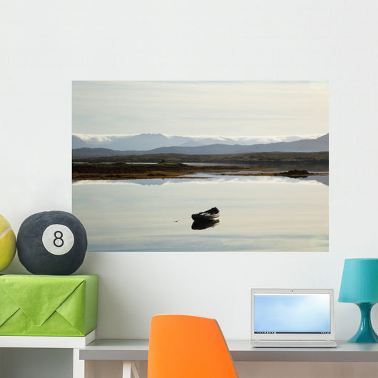 A rowboat sits Wall Mural