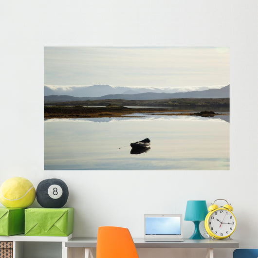 A rowboat sits Wall Mural