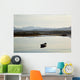 A rowboat sits Wall Mural