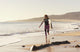 Spain, Andalusia, Cadiz, Costa de la Luz, Surfer on beach Wall Mural