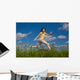 Girl Jumping Running against Wall Mural