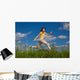 Girl Jumping Running against Wall Mural