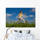 Girl Jumping Running against Wall Mural