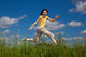 Girl Jumping Running against Wall Mural