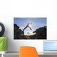 Backlit View Of Hiker Leaping Between Rocks Near Noatak River Wall Mural