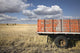Weather-Beaten Farm Truck In Field Wall Mural
