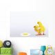 Two yellow baby chicks looking at fried egg;British columbia canada Wall Mural