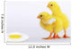 Two yellow baby chicks looking at fried egg;British columbia canada Wall Mural